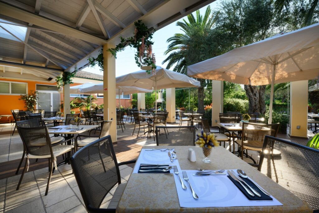 Terrace set for an evening under the pergola